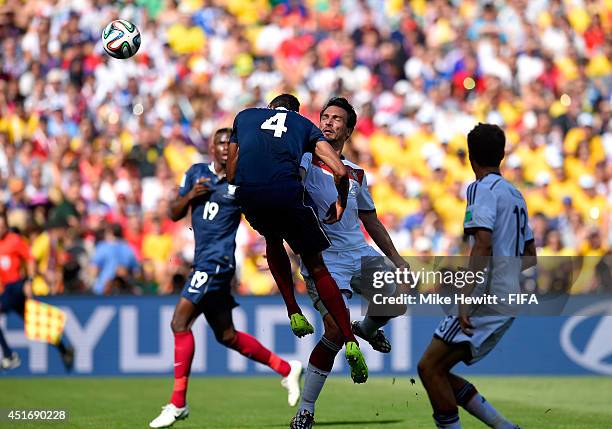 Mats Hummels of Germany scores his team's first goal during the 2014 FIFA World Cup Brazil Quarter Final match between France and Germany at Maracana...