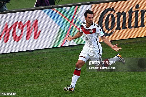 Mats Hummels of Germany celebrates scoring his team's first goal during the 2014 FIFA World Cup Brazil Quarter Final match between France and Germany...