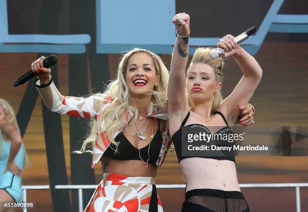 Iggy Azalea and Rita Ora perform on stage at Wireless Festival at Finsbury Park on July 4, 2014 in London, United Kingdom.