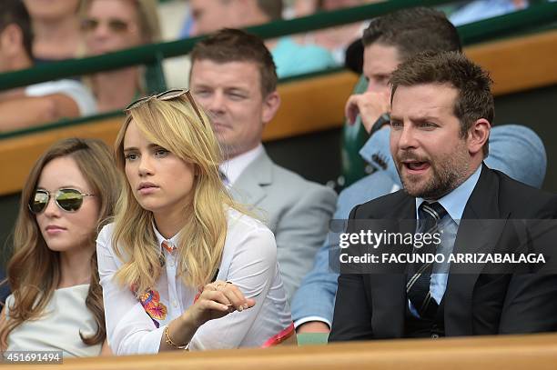 Actor Bradley Cooper and his girlfriend British model Suki Waterhouse sit in the Royal box on Centre Court as they watch the men's singles semi-final...
