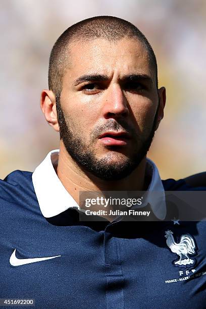 Karim Benzema of France looks on during the National Anthem prior to the 2014 FIFA World Cup Brazil Quarter Final match between France and Germany at...