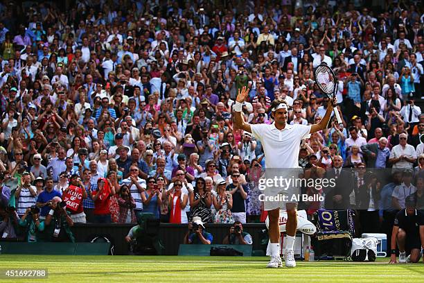 Roger Federer of Switzerland celebrates after winning his Gentlemen's Singles semi-final match against Milos Raonic of Canada on day eleven of the...
