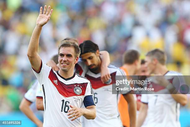Philipp Lahm of Germany acknowledges the fans after defeating France 1-0 in the 2014 FIFA World Cup Brazil Quarter Final match between France and...
