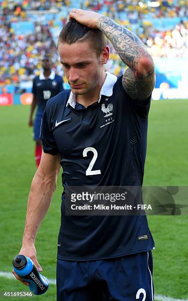Mathieu Debuchy of France walks off the pitch after the 0-1 defeat in the 2014 FIFA World Cup Brazil Quarter Final match between France and Germany...