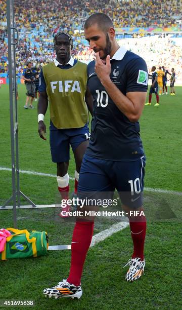 Karim Benzema of France walks off the pitch after the 0-1 defeat in the 2014 FIFA World Cup Brazil Quarter Final match between France and Germany at...