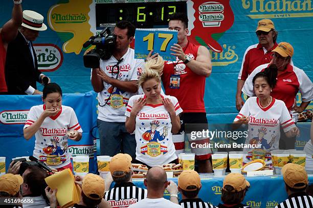 Sonya Thomas, Miki Sudo and Juliet Lee compete in the women's division of the Nathan's Famous Hot Dog Eating Contest at Coney Island on July 4, 2014...