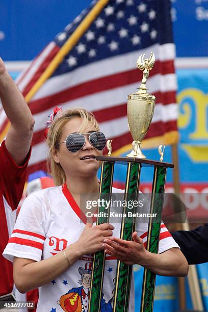 Miki Sudo wins the women's division of the Nathan's Famous Hot Dog Eating Contest at Coney Island on July 4, 2014 in the Brooklyn borough of New York...