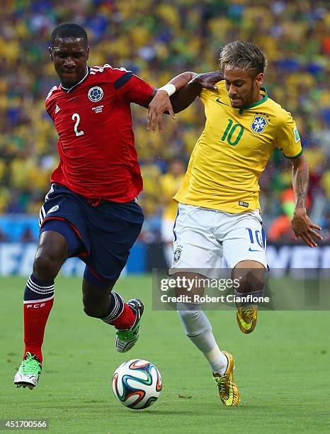 Cristian Zapata of Colombia and Neymar of Brazil compete for the ball during the 2014 FIFA World Cup Brazil Quarter Final match between Brazil and...