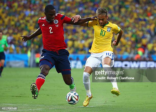 Cristian Zapata of Colombia and Neymar of Brazil compete for the ball during the 2014 FIFA World Cup Brazil Quarter Final match between Brazil and...