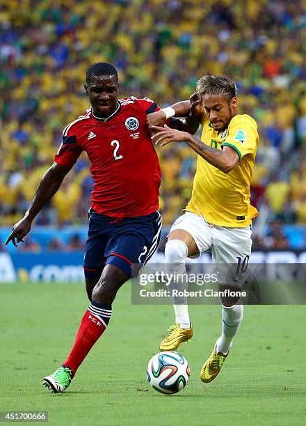 Cristian Zapata of Colombia and Neymar of Brazil compete for the ball during the 2014 FIFA World Cup Brazil Quarter Final match between Brazil and...