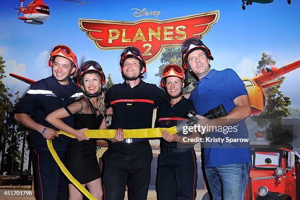 Audrey Lamy and Fred Testot attend the 'Planes 2' Paris Premiere at MK2 Bibliotheque on July 4, 2014 in Paris, France.