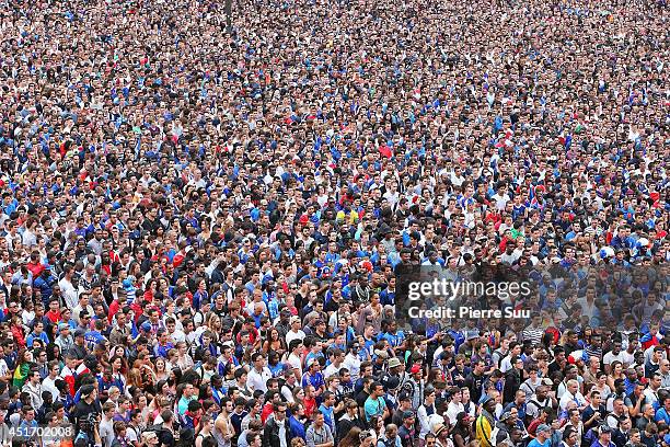 French fans watch the 2014 FIFA World Cup Quarter Final Football Match on a giant screen at the Hotel De Ville, also known as the Paris City Hall, on...