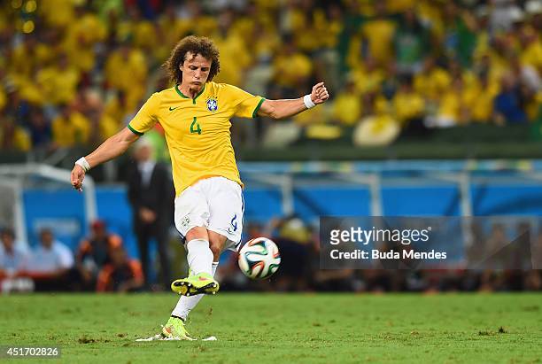 David Luiz of Brazil scores his team's second goal on a free kick during the 2014 FIFA World Cup Brazil Quarter Final match between Brazil and...