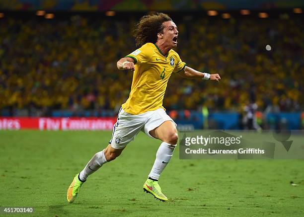 David Luiz of Brazil celebrates scoring his team's second goal on a free kick during the 2014 FIFA World Cup Brazil Quarter Final match between...