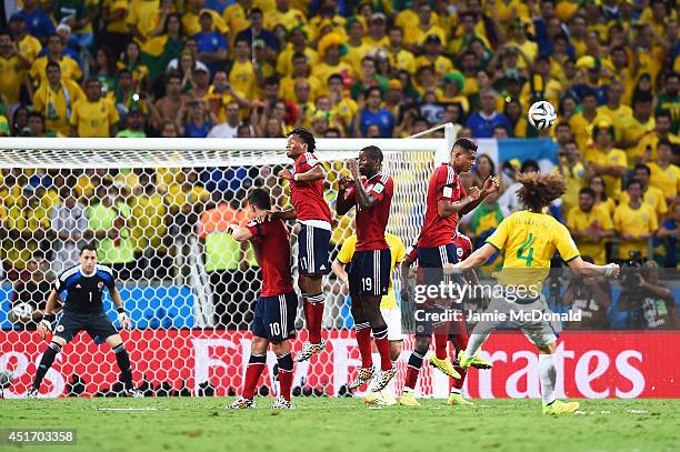 David Luiz of Brazil scores his team's second goal on a free kick past David Ospina of Colombia during the 2014 FIFA World Cup Brazil Quarter Final...