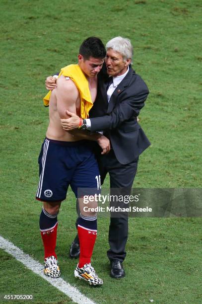 Head coach Jose Pekerman of Colombia consoles James Rodriguez after being defeated by Brazil 2-1 during the 2014 FIFA World Cup Brazil Quarter Final...