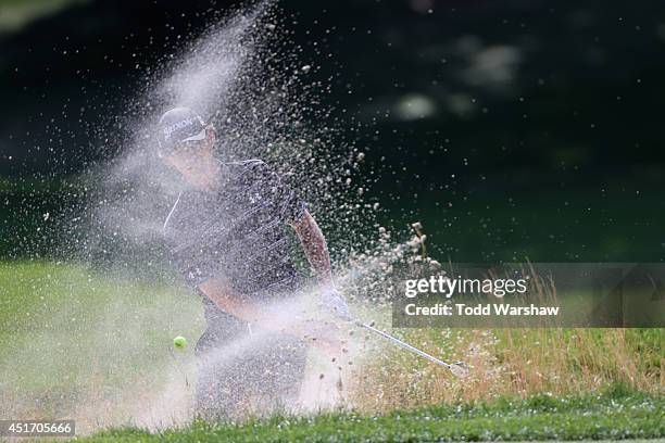 Will Wilcox hits out of a bunker on the second hole during the second round of the Greenbrier Classic at the Old White TPC on July 4, 2014 in White...