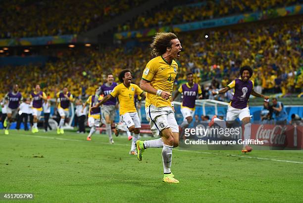 David Luiz of Brazil celebrates scoring his team's second goal during the 2014 FIFA World Cup Brazil Quarter Final match between Brazil and Colombia...