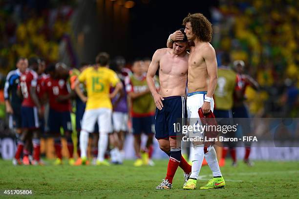 James Rodriguez of Colombia is consoled by David Luiz of Brazil after the 2014 FIFA World Cup Brazil Quarter Final match between Brazil and Colombia...