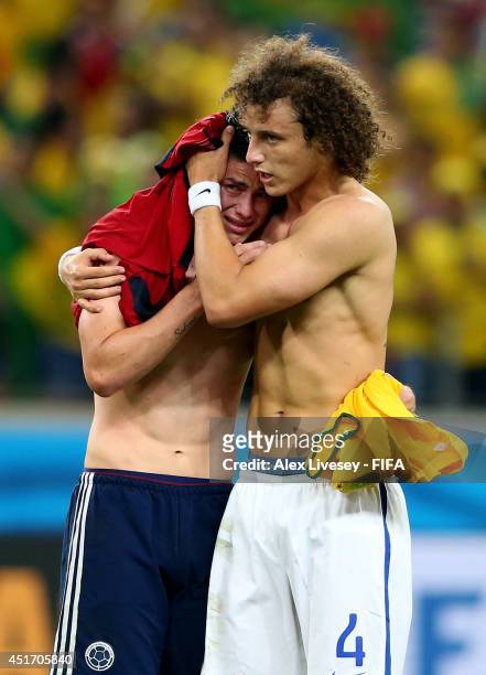 James Rodriguez of Colombia is consoled by David Luiz of Brazil after the 2014 FIFA World Cup Brazil Quarter Final match between Brazil and Colombia...