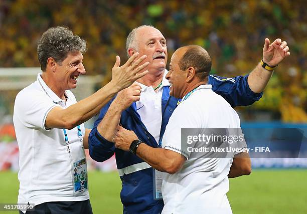 Head coach Luiz Felipe Scolari of Brazil celebrates the 2-1 win with team staffs after the 2014 FIFA World Cup Brazil Quarter Final match between...