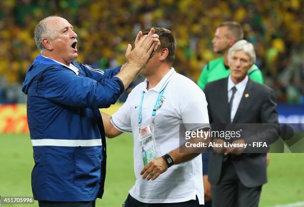 Head coach Luiz Felipe Scolari of Brazil celebrates the 2-1 win with a team staff after the 2014 FIFA World Cup Brazil Quarter Final match between...