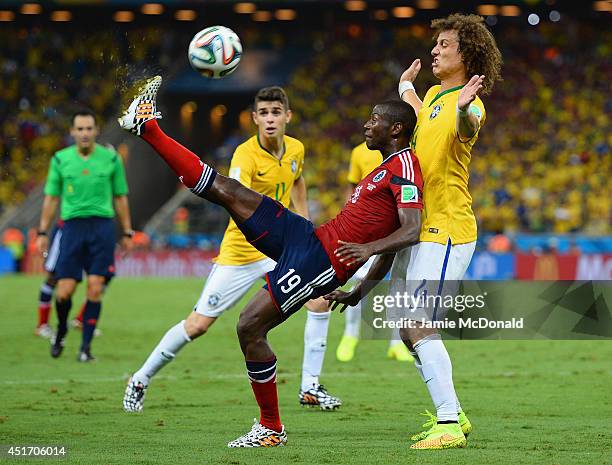 Adrian Ramos of Colombia controls the ball against David Luiz of Brazil during the 2014 FIFA World Cup Brazil Quarter Final match between Brazil and...