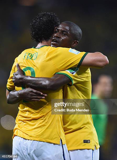 Fred and Ramires of Brazil celebrate after defeating Colombia 2-1 during the 2014 FIFA World Cup Brazil Quarter Final match between Brazil and...