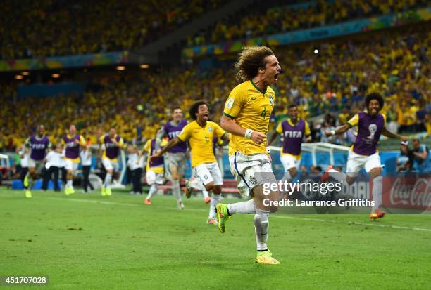 David Luiz of Brazil celebrates scoring his team's second goal during the 2014 FIFA World Cup Brazil Quarter Final match between Brazil and Colombia...