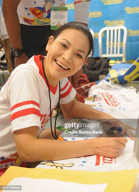 Sonya Thomas competes in the Women's Division at the 2014 Nathan's Famous 4th July International Hot Dog Eating Contest at Coney Island on July 4,...