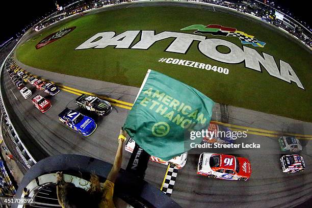Dakoda Armstrong, driver of the Fresh from Florida Ford, and Trevor Bayne, driver of the AdvoCare Ford, lead the field to start the NASCAR Nationwide...