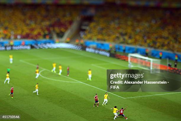 Marcelo of Brazil battles for the ball with Juan Zuniga of Colombia during the 2014 FIFA World Cup Brazil Quarter Final match between Brazil and...