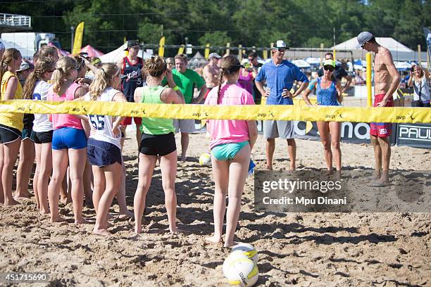 Ryan Doherty , Laryssa Mereszczak , and Steve Grotkowski teach a clinic during the afternoon at the AVP Milwaukee Open on July 4, 2014 at Bradford...