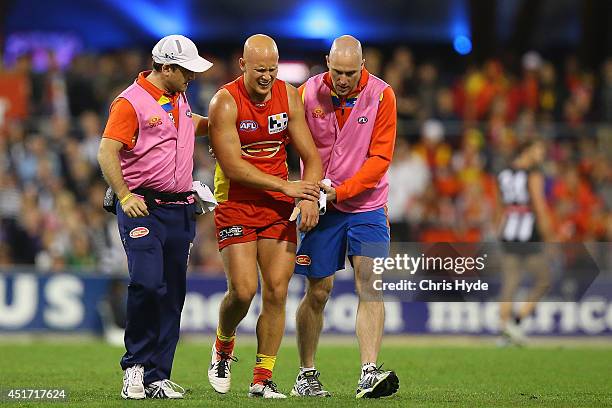 Gary Ablett of the Suns leaves the field injured the round 16 AFL match between the Gold Coast Suns and the Collingwood Magpies at Metricon Stadium...