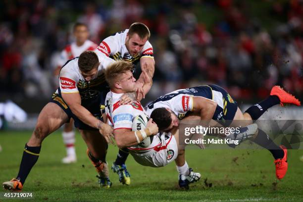 Jack de Belin of the Dragons is tackled during the round 17 NRL match between the St George Illawarra Dragons and the North Queensland Cowboys at WIN...