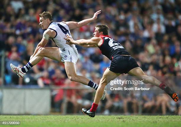 Colin Sylvia of the Dockers attempts to kick a goal during the round 16 AFL match between the Melbourne Demons and the Fremantle Dockers at TIO...