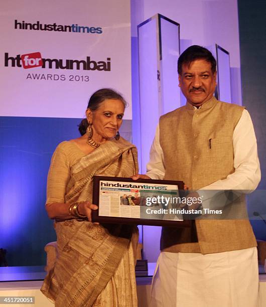 Chief Minister Shri Prithviraj Chauhan felicitates winners during the HT for Mumbai Awards 2013 at Hotel Four Seasons, Worli on November 22, 2013 in...