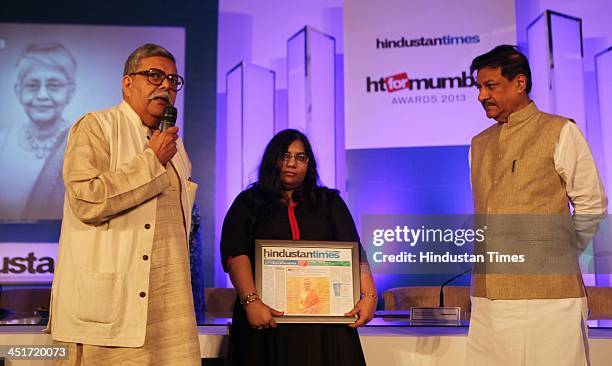 Sharada Dwivedi's husband and daughter receive award on behalf of her from Chief Minister Shri Prithviraj Chauhan during the HT for Mumbai Awards...