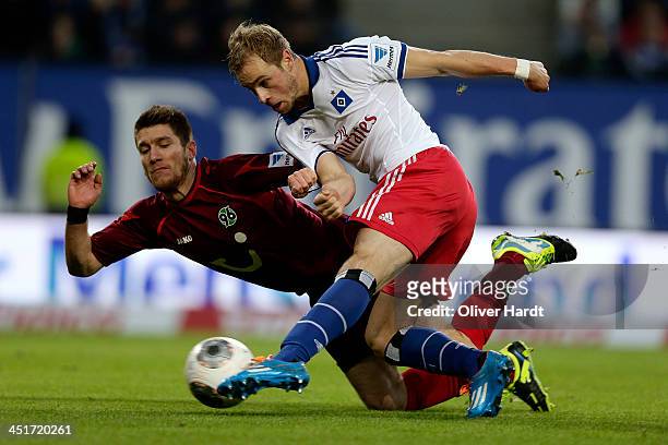 Maximilian Beister of Hamburg and Sebastian Pocognoli of Hannover compete for the ball during the Bundesliga match between Hamburger SV and Hannover...