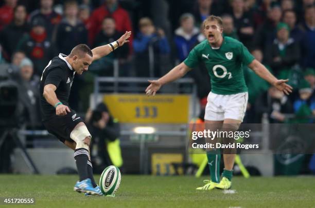 Luke Fitzgerald of Ireland rushes up to Aaron Cruden has he takes the first conversion which had to be retaken during the International match between...