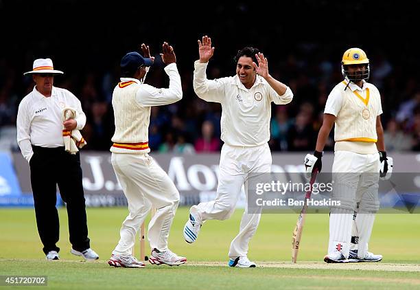 Saeed Ajmal of MCC celebrates dismissing Tamim Iqbal of Rest of the World during the MCC and Rest of the World match at Lord's Cricket Ground on July...