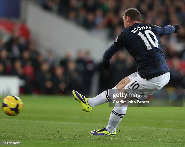 Wayne Rooney of Manchester United scores their first goal during the Barclays Premier League match between Cardiff City and Manchester United at...