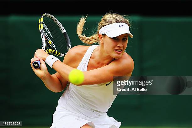 Eugenie Bouchard of Canada plays a backhand return during the Ladies' Singles final match against Petra Kvitova of Czech Republic on day twelve of...
