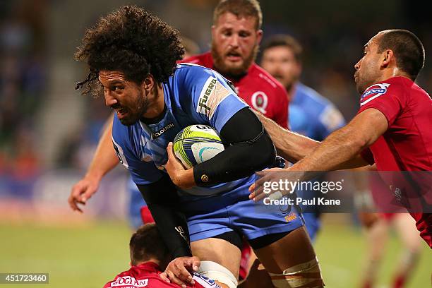 Sam Wykes of the Force looks to break from a tackle by Nick Frisby of the Reds during the round 18 Super Rugby match between the Western Force and...