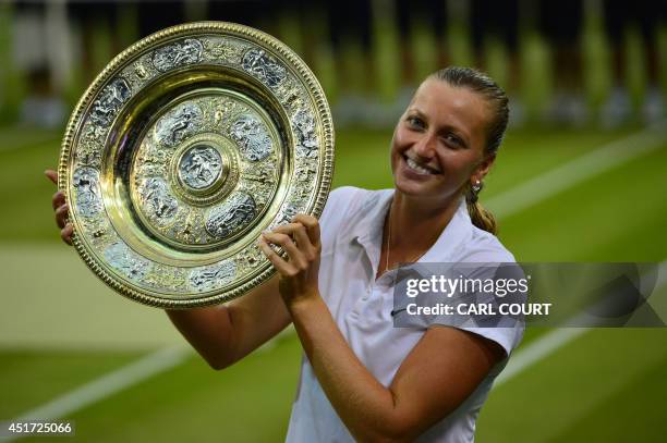 Czech Republic's Petra Kvitova holds the winner's Venus Rosewater Dish during the presentation after beating Canada's Eugenie Bouchard in the women's...
