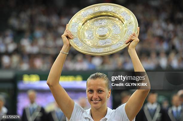 Czech Republic's Petra Kvitova holds the winner's Venus Rosewater Dish during the presentation after beating Canada's Eugenie Bouchard in the women's...