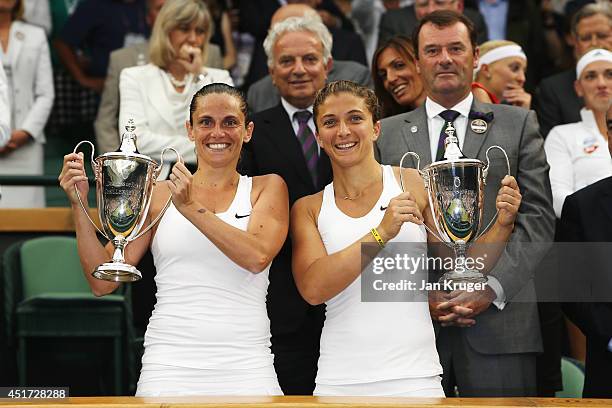 Roberta Vinci and Sara Errani of Italy celebrate with the winners trophy after the Ladies Doubles Final match against Timea Babos of Hungary and...