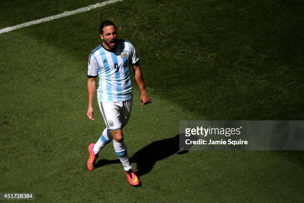 Gonzalo Higuain of Argentina celebrates scoring his team's first goal during the 2014 FIFA World Cup Brazil Quarter Final match between Argentina and...