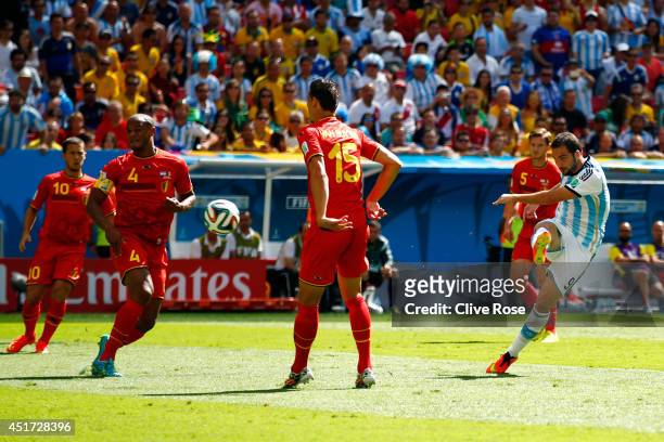 Gonzalo Higuain of Argentina scores his team's first goal during the 2014 FIFA World Cup Brazil Quarter Final match between Argentina and Belgium at...