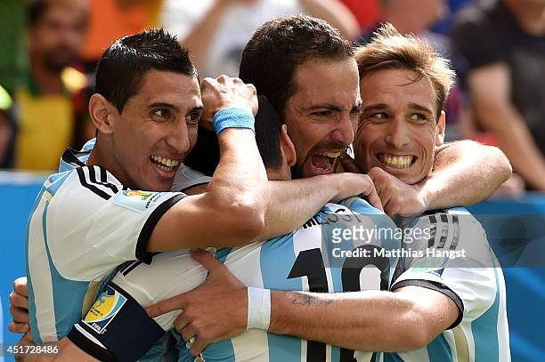 Gonzalo Higuain of Argentina celebrates scoring his team's first goal with Angel di Maria , Lionel Messi and Lucas Biglia during the 2014 FIFA World...